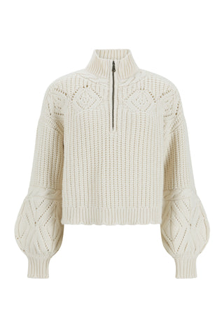 An off-white cable-knit cropped sweater with a mock neck and a short front zipper, featuring balloon sleeves with diamond-knit detailing.